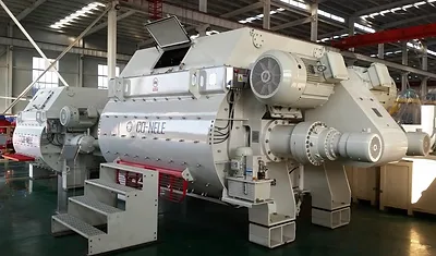Close-up of pugmill machinery mixing materials