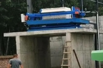 Filter press system for separating